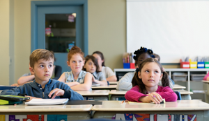 Students listening to their teacher in a classroom