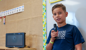 Student using Lightspeed Sharemike during presentation in the classroom