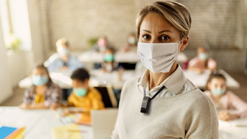Teacher using Flexmike while also having to be masked up in the classroom