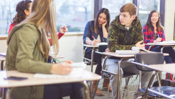 Diverse students work together in class