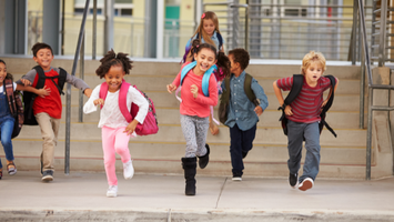 Students leaving their school after a successful and productive day