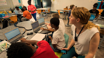 Teacher using their Lightspeed Flexmike for instructional audio in the classroom