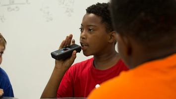 Diverse students using the Lightspeed Activate system with Pods for small group learning