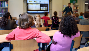 Young students in class with a teacher who is using Instructional Audio