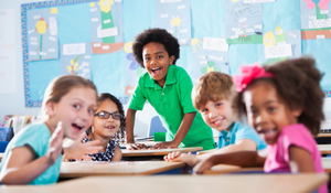 Young students having a great time learning in the classroom